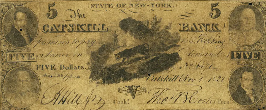 A counterfeit of an 1828 note from Catskill Bank in New York, which features an image of a wild cat.